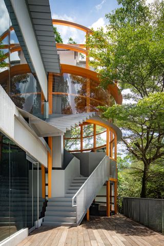 Exterior of AIR, a staircase with orange details