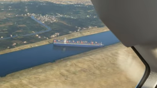 An image of the cargo ship Ever Given stuck in the Suez Canal, modded into Microsoft Flight Simulator.