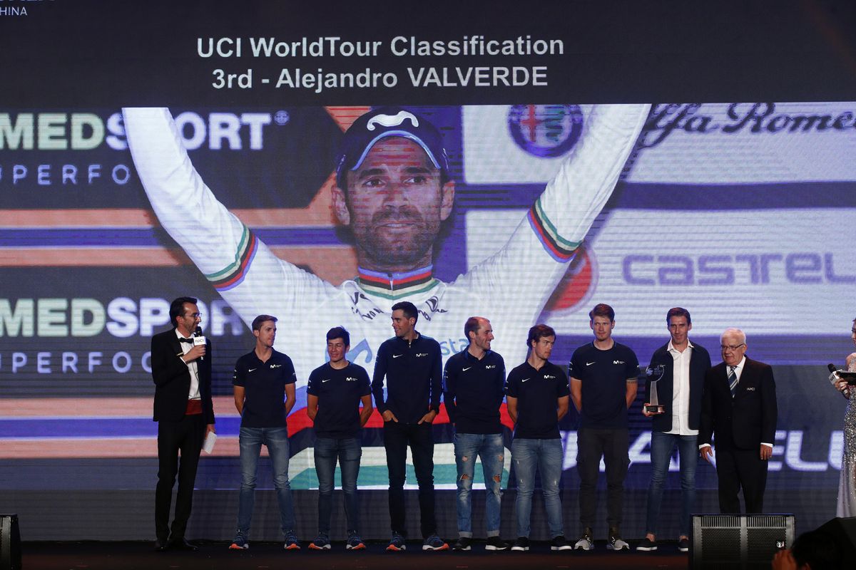 Members of the Movistar team represent Valverde on stage