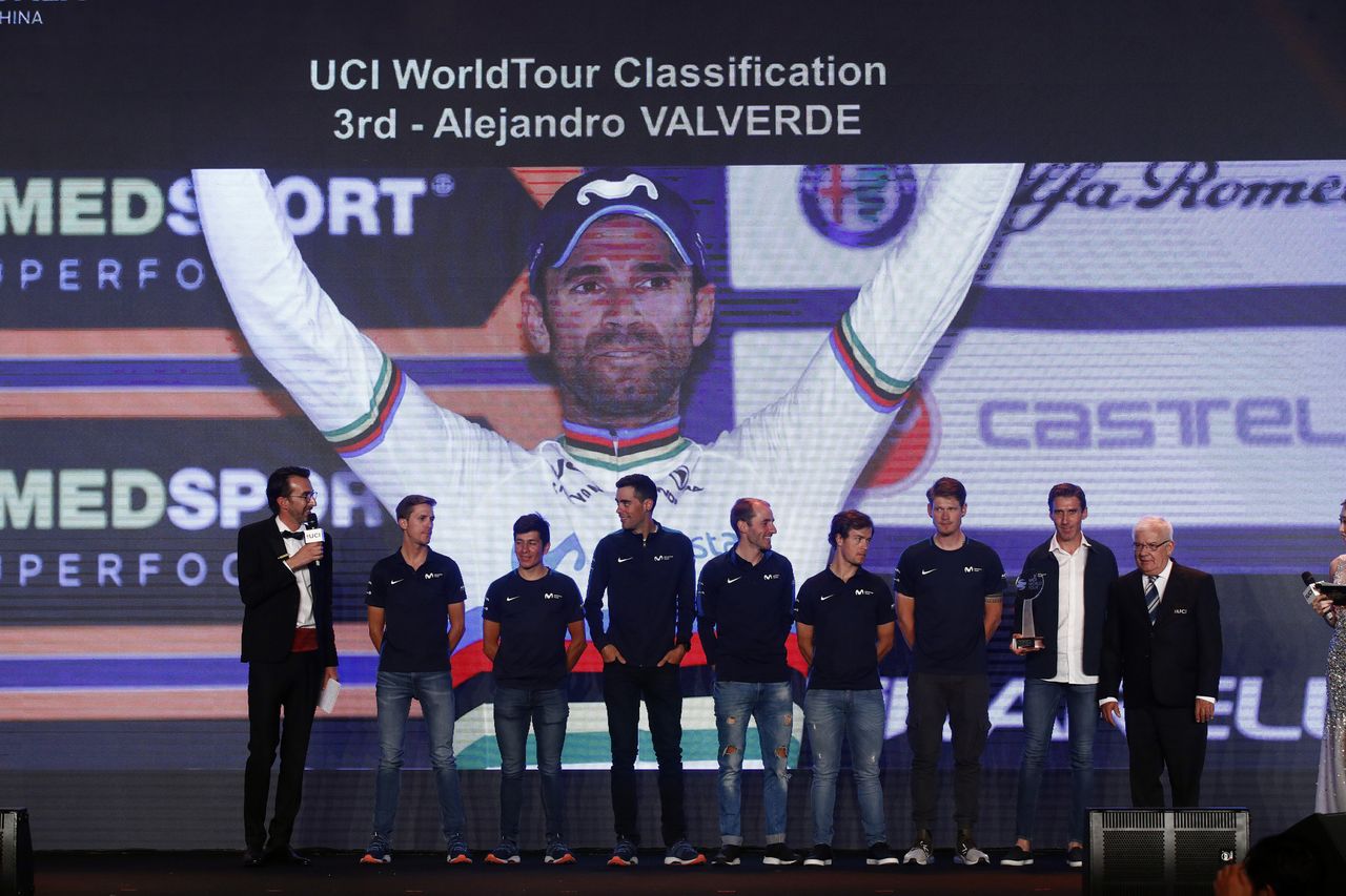 Members of the Movistar team represent Valverde on stage