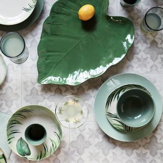 green accessories with bowl on plate and lemon
