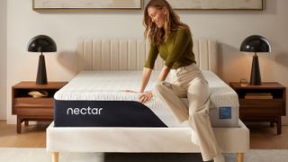 A woman feels the comfort and support of the Nectar Classic Mattress