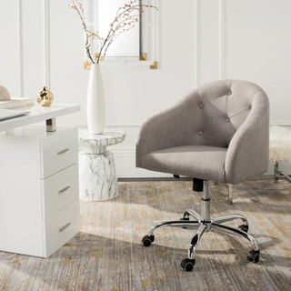 A gray tufted office chair