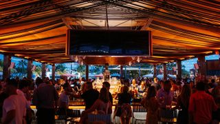 Miami's Regatta Grove, an outdoor Waterfront entertainment venue at night.