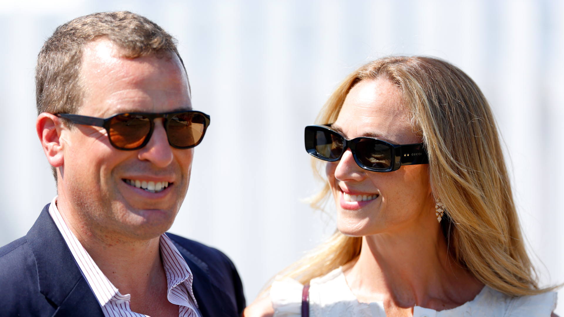 Peter Phillips and Harriet Sperling wearing sunglasses and smiling
