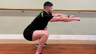 Man doing bodyweight squats