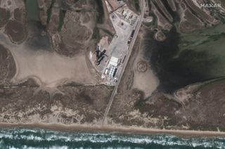 SpaceX's Starship and Super Heavy rocket stand atop their launch pad near Boca Chica Beach in South Texas in this Maxar satellite photo of SpaceX's Starbase test site taken on April 17, 2023.