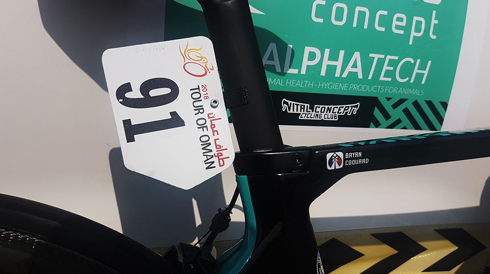 A small carbon number plate mount is glued to Coquard's seat post