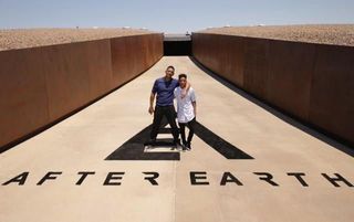"After Earth" stars Will and Jaden Smith pose for a photo at New Mexico's Spaceport America during the press junket for their science fiction film on May 17, 2013.
