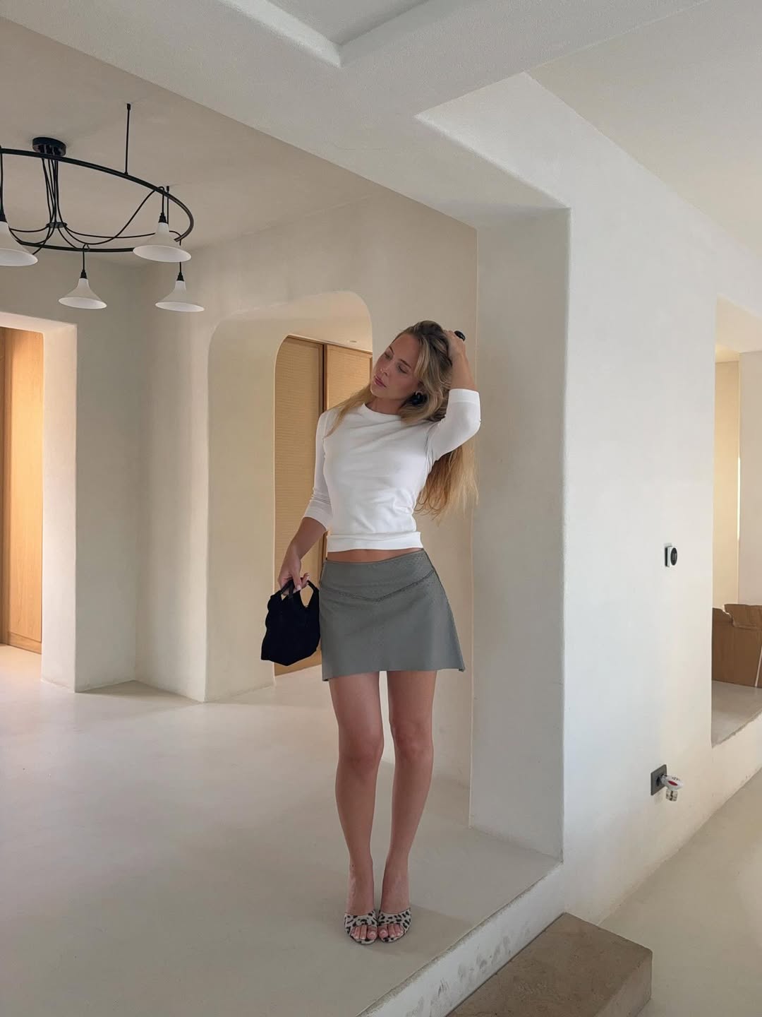 @karolinebeltner wears copenhagen summer outfits grey skirt animal print mules