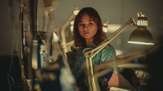Lucy (Ruby Stokes) surrounded by hospital equipment
