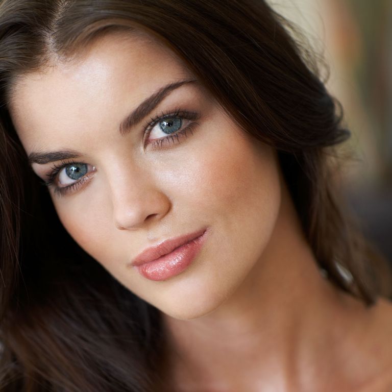 Photo of a model with dark hair and natural make-up