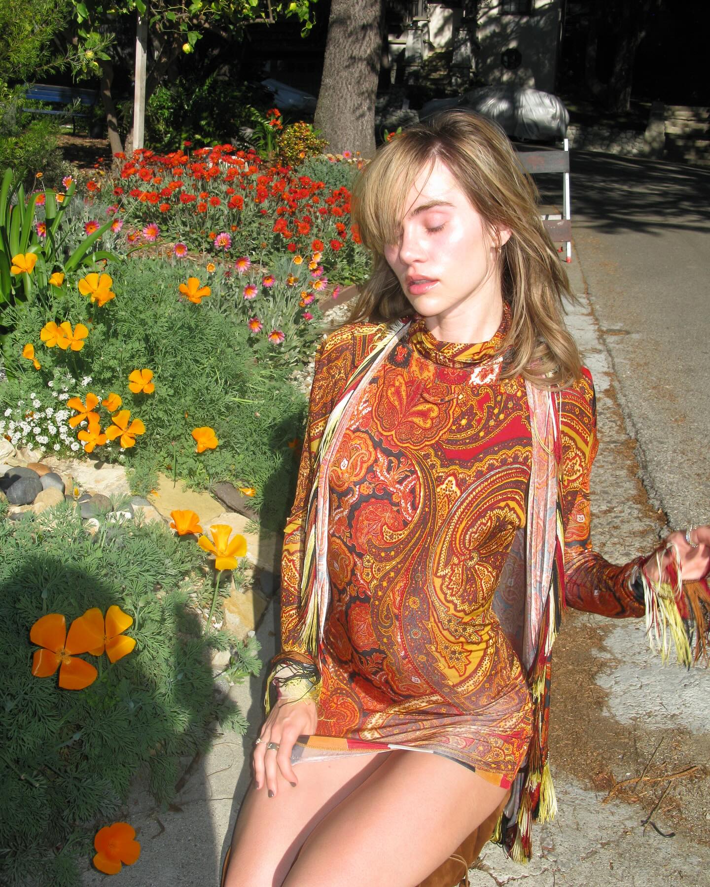 @sukiwaterhouse wearing a floral dress with butterscotch blonde hair