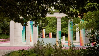 colourful columns in a park for Temple of Boom, the 2022 NGV Architecture Commission