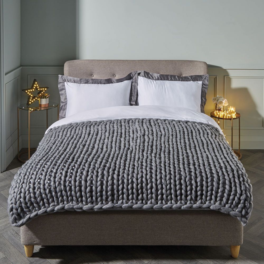 Hibernate in style with the new grey chunky knit throw arriving at Aldi