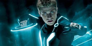 Tron: Legacy Sam Flynn, in his Grid suit holding an ID disk