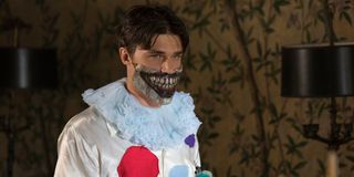 Dandy Mott wearing Twisty the Clown's mask in _American Horror Story: Freak Show._