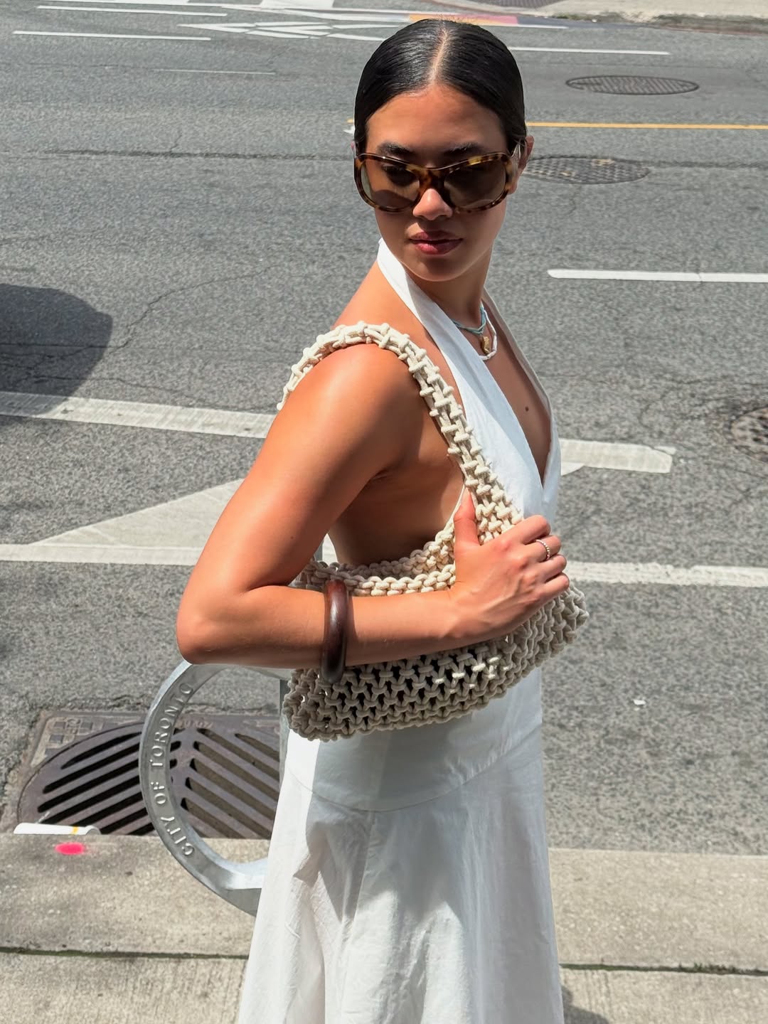 Sasha wearing a rope shoulder bag