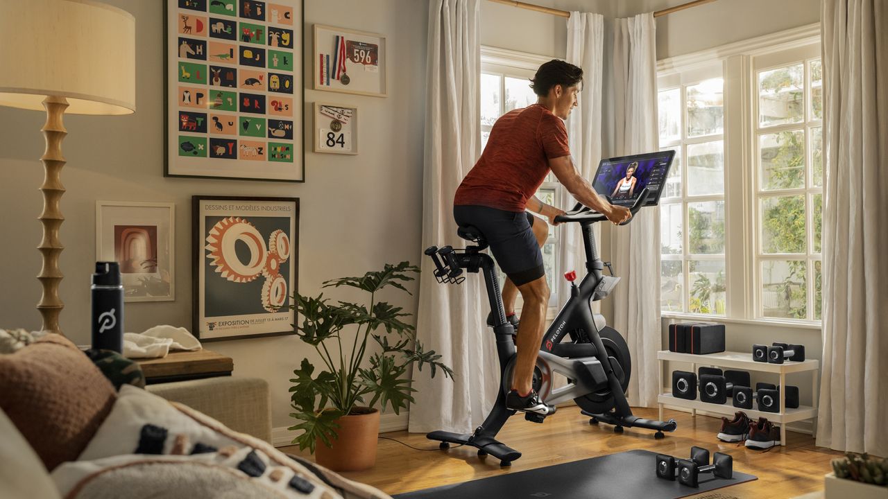 Man riding the Peloton Bike