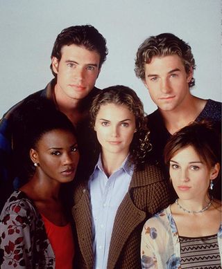 the cast of felicity poses with keri russell in the center in a promotional shot for the show