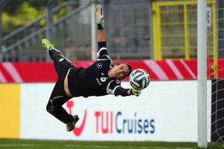 Goalkeeper Nadine Angerer makes a save during a Germany training session at Carl-Benz-Stadion on April 9, 2014 in Mannheim, Germany. (Photo by Alex Grimm/Bongarts/Getty Images)