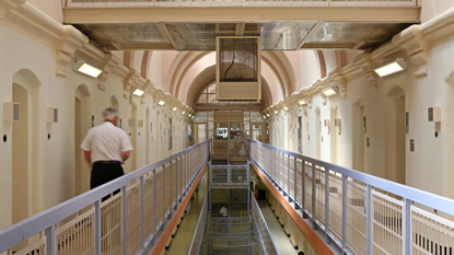 A prison guard walks down the hall in London&#039;s Wandsworth prison