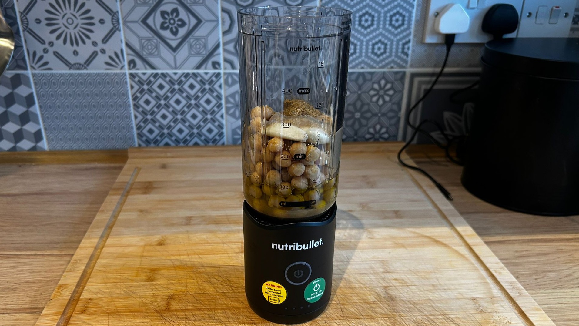 Nutribullet Flex blender containing ingredients for hummus