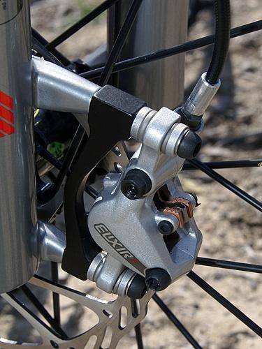 The new two-piece caliper uses bigger pistons for more power and top-loaded pads.