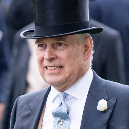 Ex-Prince Andrew, the former Duke of York, makes a grimacing face while wearing a top hat on day five of Royal Ascot at Ascot Racecourse on June 22, 2019