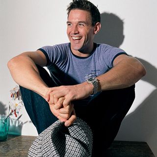 alistair appleton with blue tshirt and wrist watch