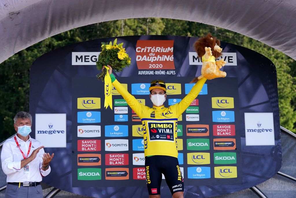 MEGEVE FRANCE AUGUST 15 Podium Primoz Roglic of Slovenia and Team Jumbo Visma Yellow Leader Jersey Celebration Covid safety measures Flowers Mascot during the 72nd Criterium du Dauphine 2020 Stage 4 a 1533km stage from Ugine to Megeve 1458m dauphine Dauphin on August 15 2020 in Megeve France Photo by Eddy LemaistrePool via Getty Images