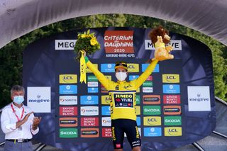 MEGEVE FRANCE AUGUST 15 Podium Primoz Roglic of Slovenia and Team Jumbo Visma Yellow Leader Jersey Celebration Covid safety measures Flowers Mascot during the 72nd Criterium du Dauphine 2020 Stage 4 a 1533km stage from Ugine to Megeve 1458m dauphine Dauphin on August 15 2020 in Megeve France Photo by Eddy LemaistrePool via Getty Images