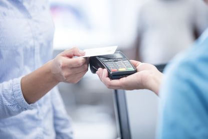 Person paying by contactless card payment