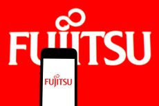 The Fujitsu logo on a smartphone and the wall in the background