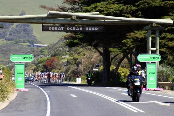 The bunch passes through one of the day's sprint points as they reel in the break.