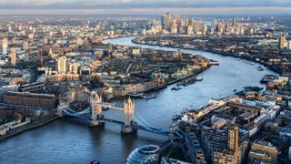 A bend in the River Thames showing Tower Bridge and looking to Canary Wharf