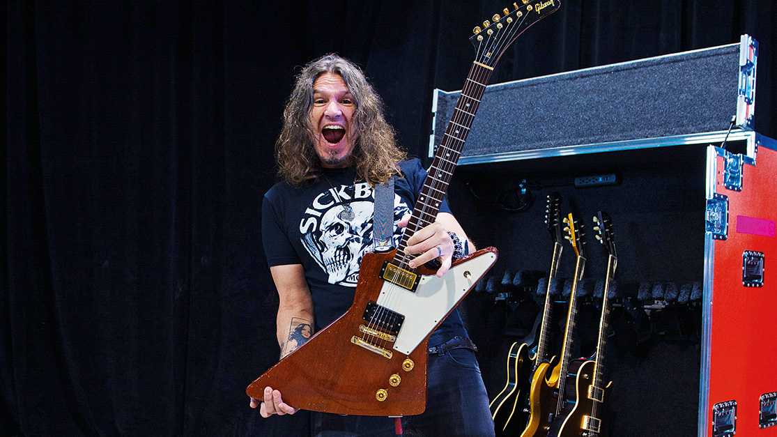 Rik Emmett and Phil X pose with Gibson guitars