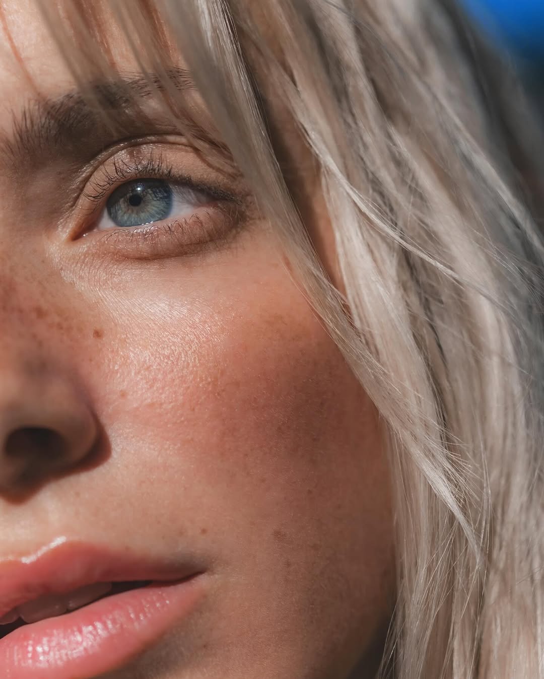 Victoria Beckham Beauty bronzing drops on a model with super blonde hair and freckles