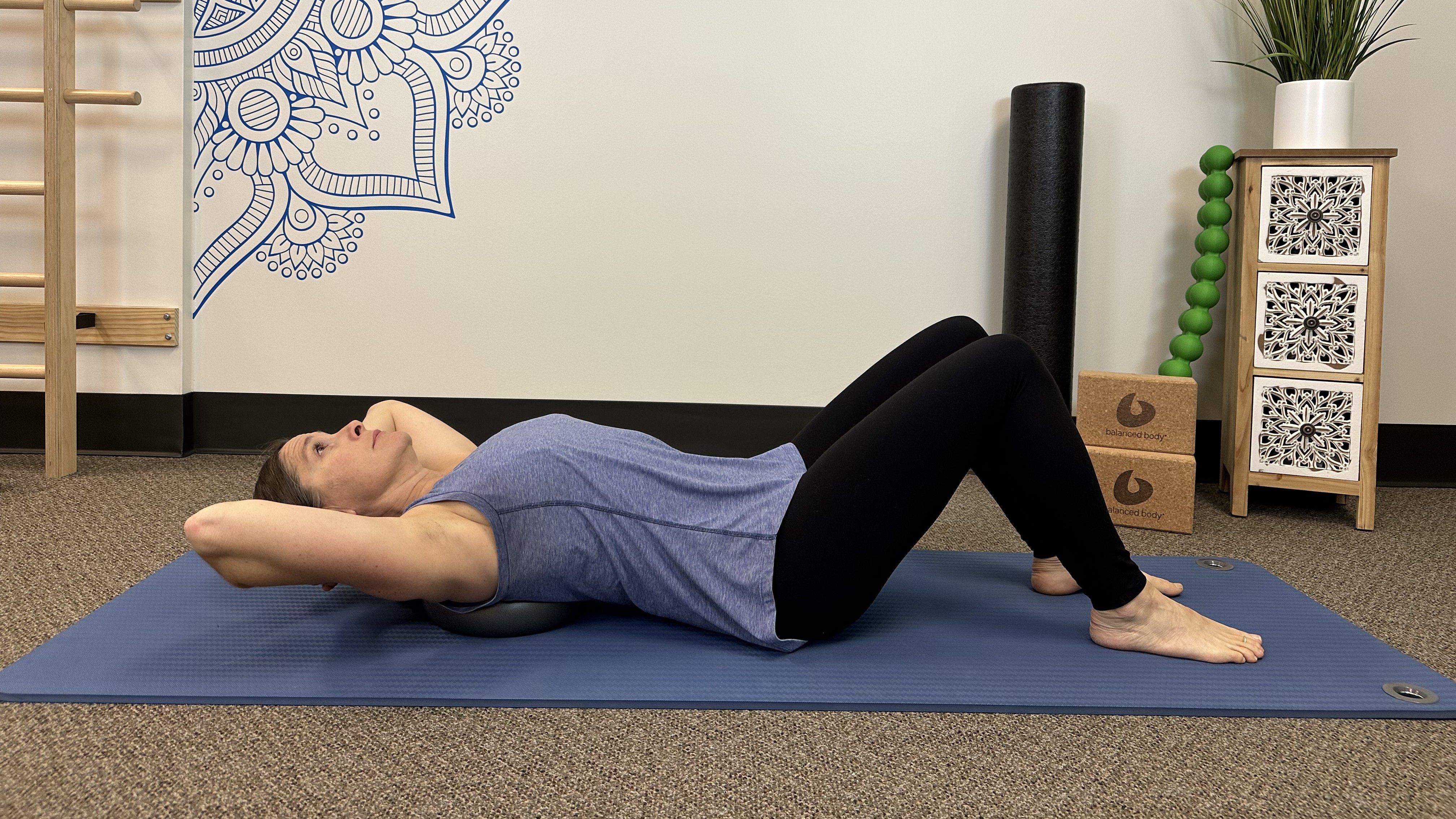 Woman demonstrates back stretch