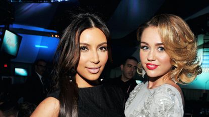 Kim Kardashian and Miley Cyrus attend the 20th Annual Elton John AIDS Foundation Academy Awards Viewing Party at The City of West Hollywood Park on February 26, 2012 in Beverly Hills, California.