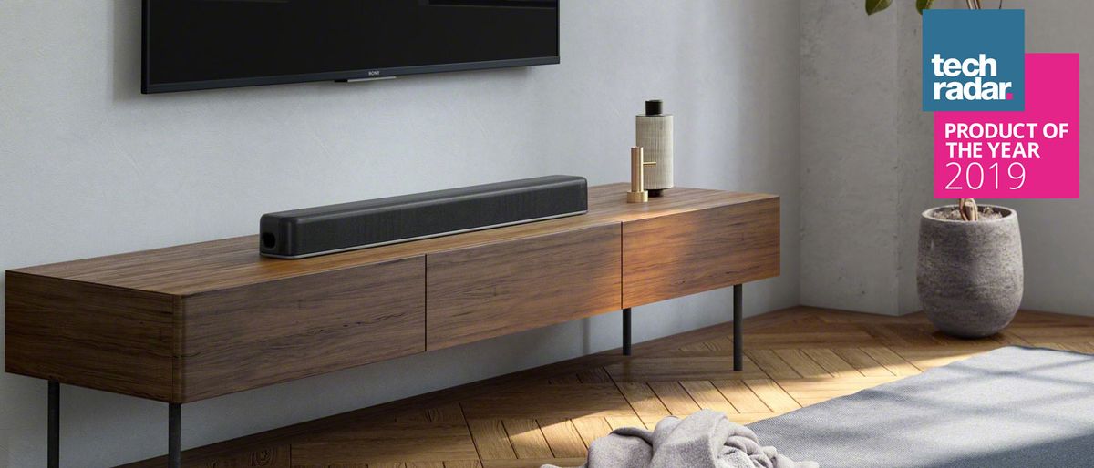 The Sony HT-X8500 soundbar pictured in a living room on a TV cabinet