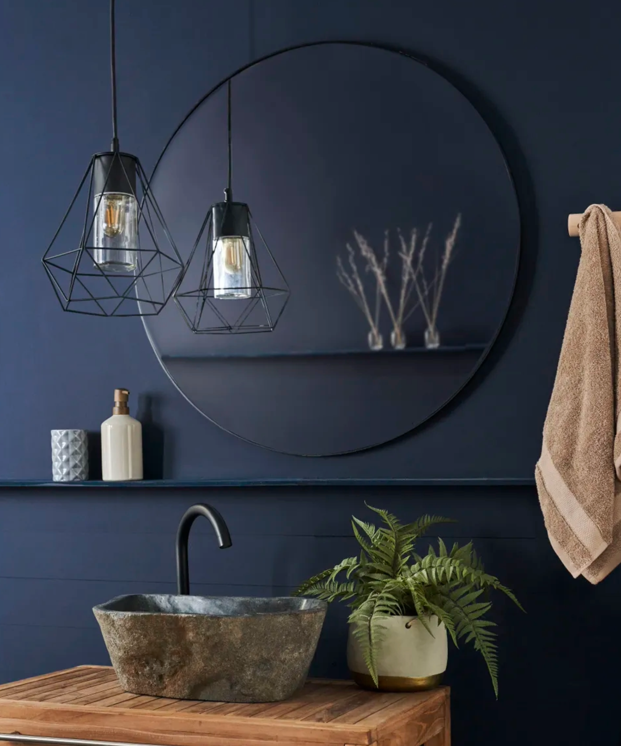 wooden vanity units with mirror and black pendant light in toilet
