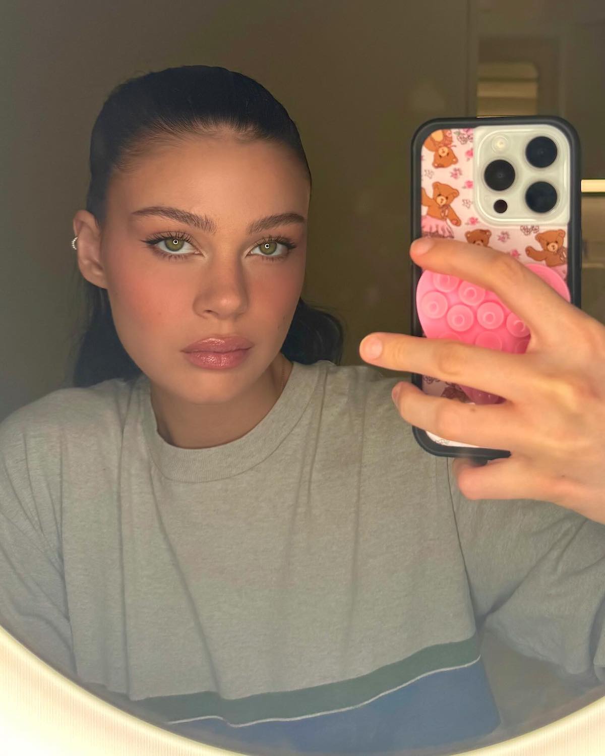 Nicola Peltz Beckham taking a mirror selfie.