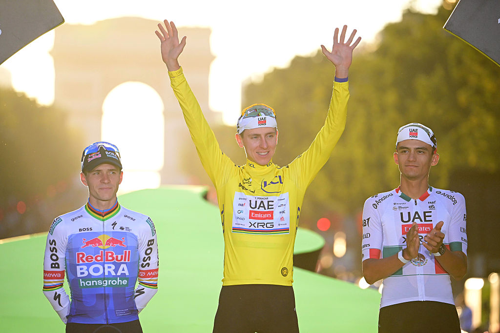 (L-R) Remco Evenepoel of Belgium and Team Red Bull - BORA - hansgrohe on second place, final overall winner - Tadej Pogacar of Slovenia and UAE Team Emirates - XRG - Yellow Leader Jersey and Isaac Del Toro of Mexico and UAE Team Emirates - XRG on third place pose on the podium ceremony after the 113th Tour de France 2026, Stage 21 a 89km stage from Paris to Paris / #UCIWT / on July 26, 2026 in Paris, France. (Photo by Bernard Papon - Pool/Getty Images)
