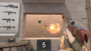 A player shoots a piece of fruit in a Counter-Strike mod that replicates Fruit Ninja.