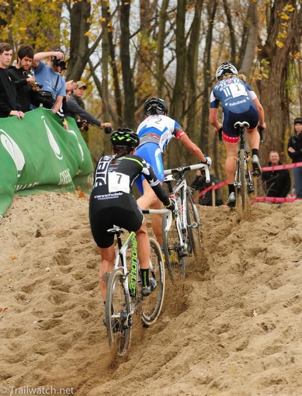Katerina Nash (Luna Pro Team) is forced off her bike as Katie Compton rides away