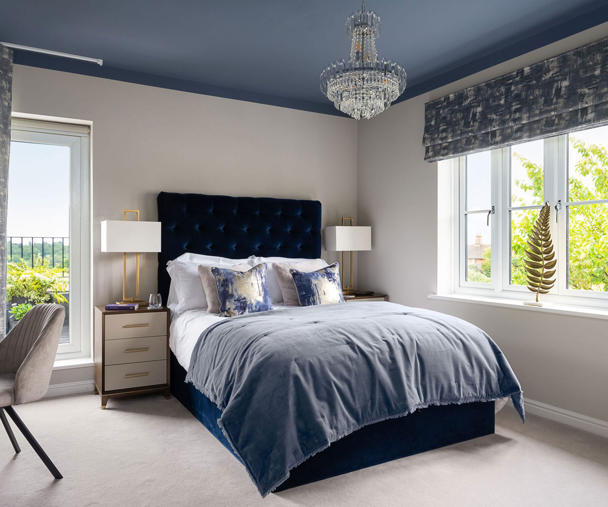 double bedroom with blue ceiling and chandelier