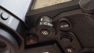 The Lumix S1R has a firm and solid feel and its size means there's room for a lot of external controls, including this handy focus mode selector and AF-ON button.