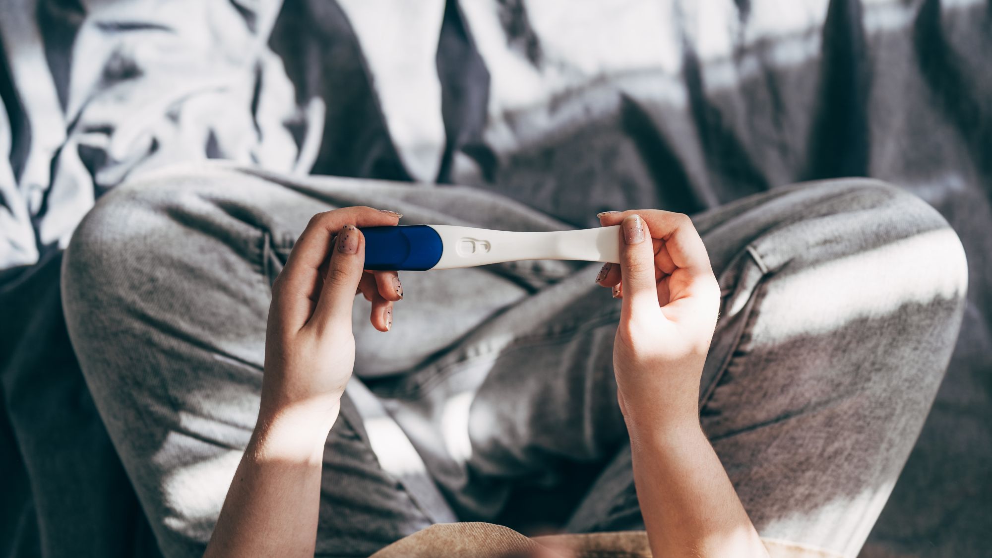 Rear View Cropped Shot Of Unrecognizable Woman Taking Pregnancy Test At Home