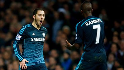 Eden Hazard of Chelsea celebrates with a teammate 